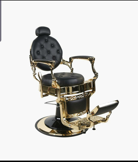 Silla de barbería de cuero negra mate con estructura de oro.
